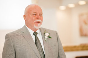 Emotional wedding photo of a father seeing his daughter for the first time captured by a Luxury Atlanta Wedding Photographer