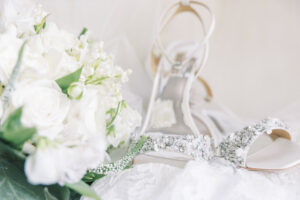 Bridal bouquet and wedding shoes detail photo for Christ the King Cathedral wedding in Atlanta