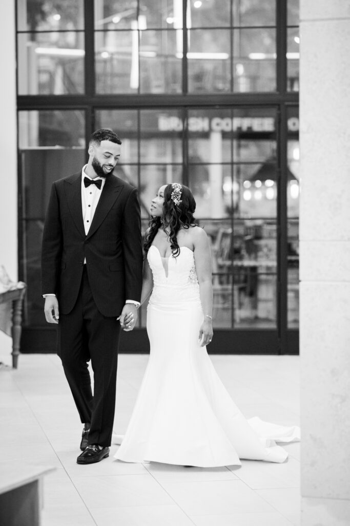 Documentary-inspired black and white wedding portrait of bride and groom at Atlanta History Center