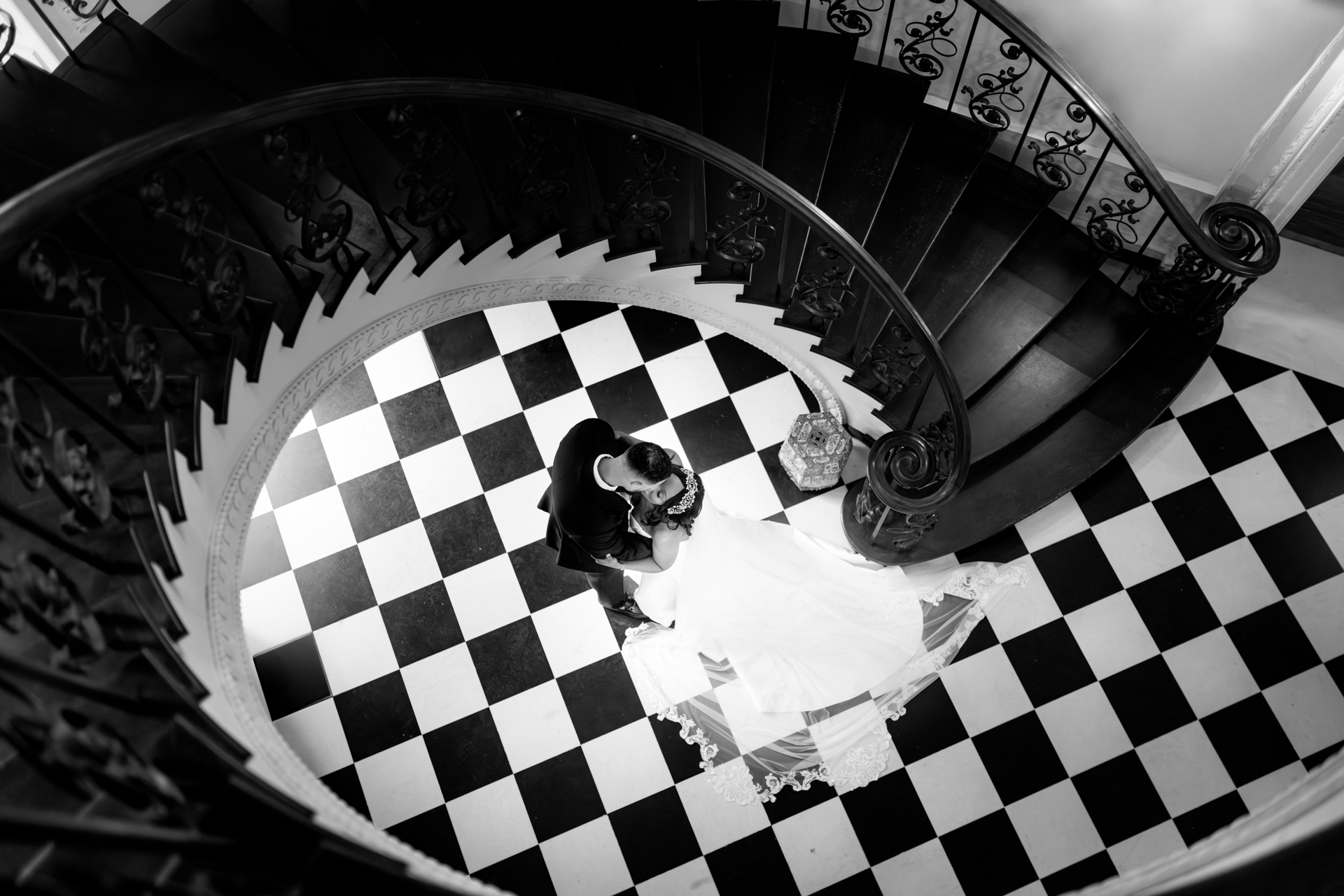 Fine art black and white overhead portrait beneath the iconic Swan House staircase in Atlanta