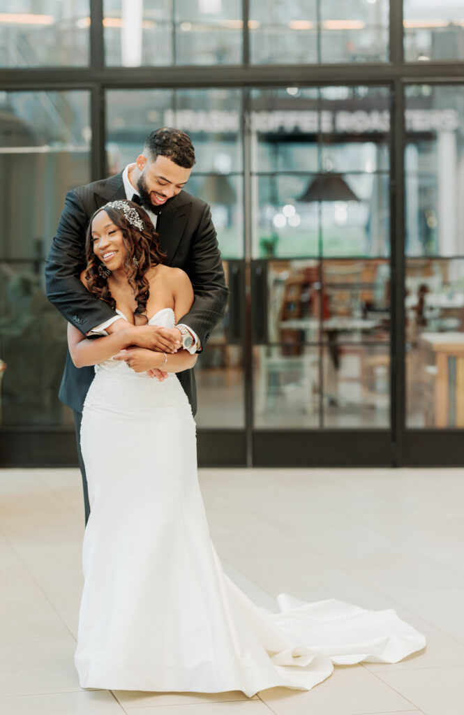 Luxury Atlanta wedding portrait of bride and groom embracing during Swan House & Atlanta History Center wedding reception