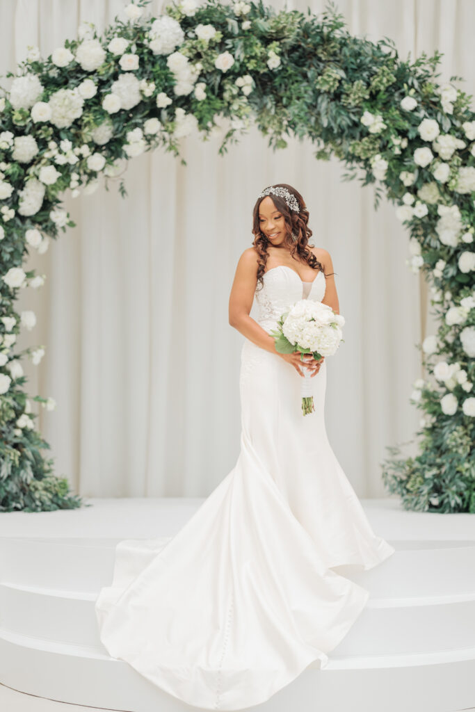 Elegant bridal portrait at Swan House Atlanta History Center with timeless white florals and luxury wedding styling