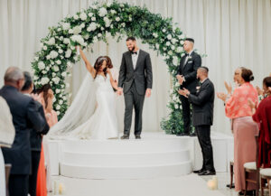 Storytelling wedding photography of bride and groom celebrating after ceremony at Swan House in Atlanta