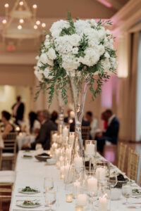 Romantic floral centerpiece design during luxury Swan House wedding reception in Atlanta