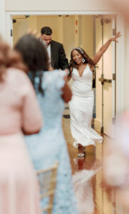 Joyful bride and groom reception entrance at Swan House Atlanta History Center wedding reception