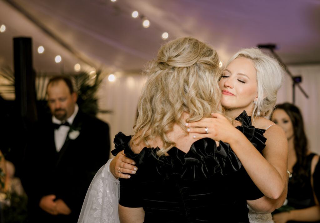 Grandmother dancing during joyful private estate wedding reception in Lake Mary