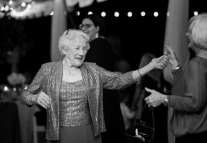 Grandmother dancing during joyful private estate wedding reception in Lake Mary