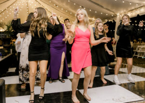 Wedding guests dancing during lively private estate wedding reception in Lake Mary