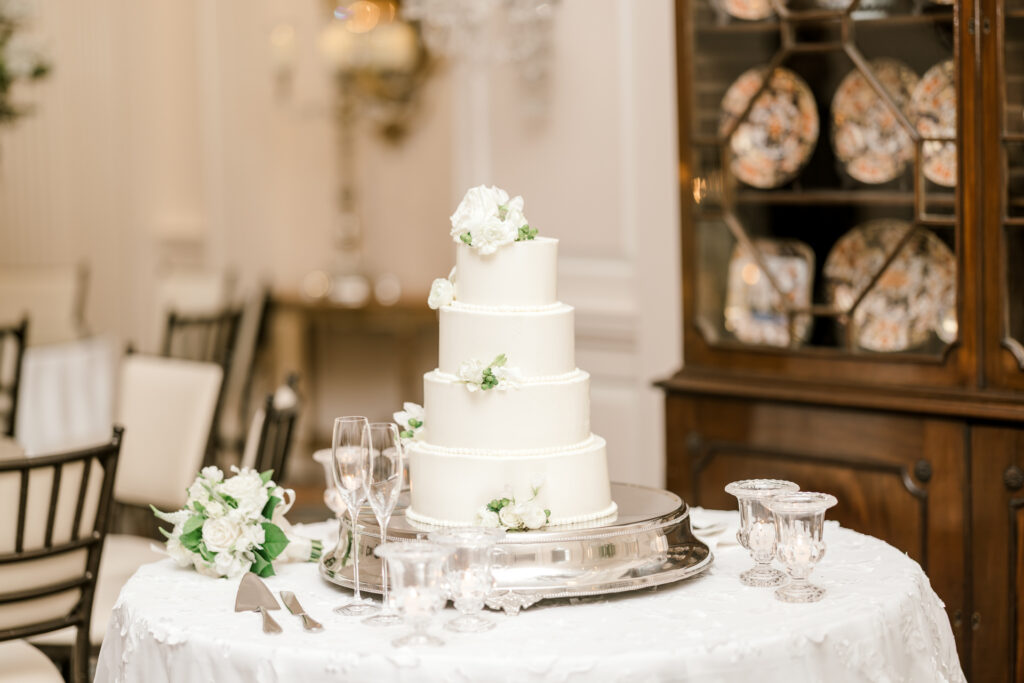 Timeless white wedding cake display at Capital City Club reception in Atlanta
