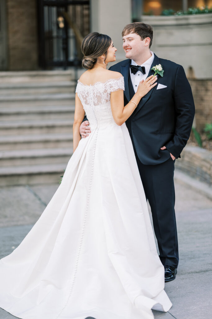 Elegant bride and groom portrait outside Capital City Club in Atlanta with timeless editorial wedding style