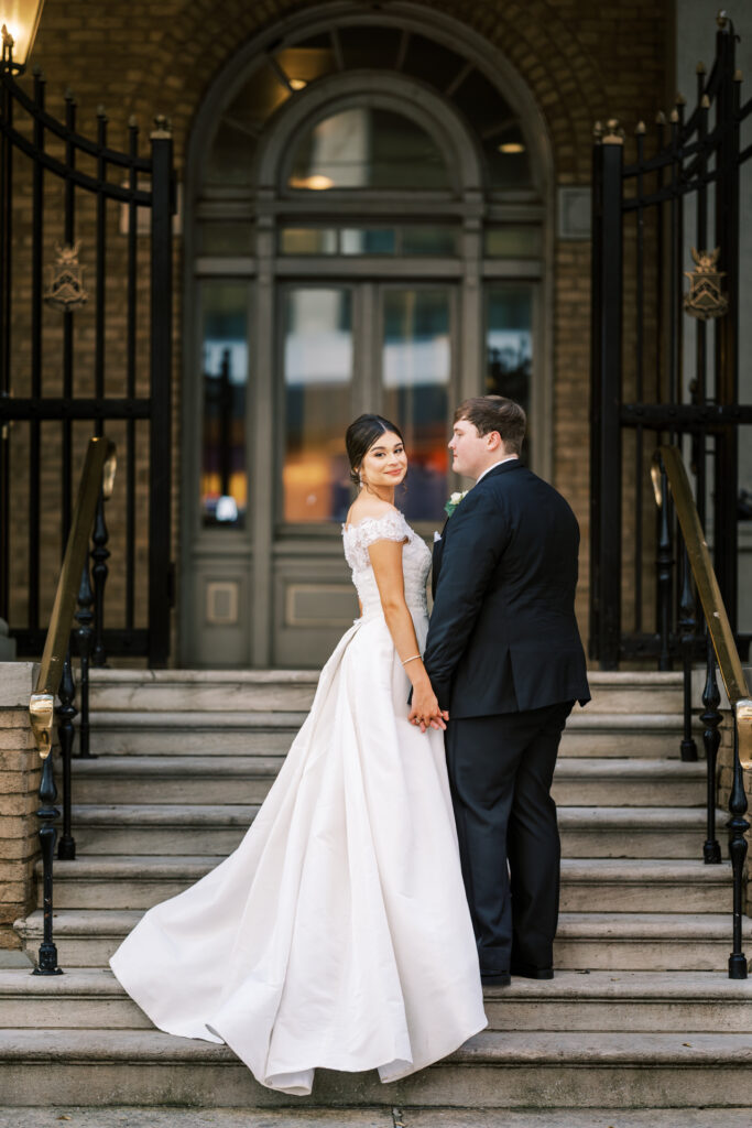 Elegant bride and groom portrait with timeless black tuxedo and satin wedding gown in Atlanta