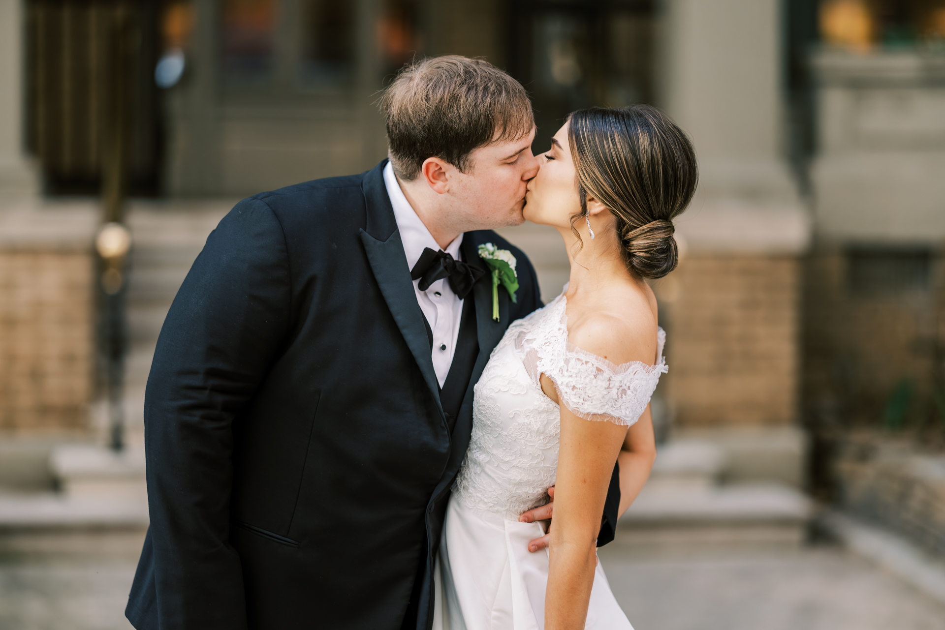 Romantic wedding kiss portrait outside Capital City Club Atlanta Georgia