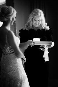 Black and white emotional bridal preparation photograph captured during a private estate wedding at Lake Mary