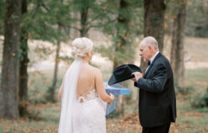 Bride sharing an emotional father daughter moment outdoors before a private Lake Mary wedding ceremony