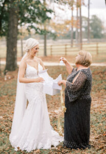 Bride sharing a meaningful outdoor moment with mom before her private estate wedding ceremony