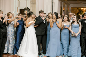 Guests cheering during wedding reception celebration at Capital City Club Atlanta