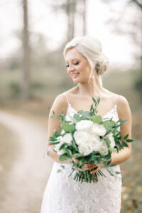 Bride standing on a countryside path during bridal portraits at a private Lake Mary wedding