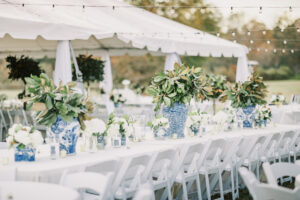 Luxury wedding reception tent with floral centerpieces during a private estate wedding at Lake Mary