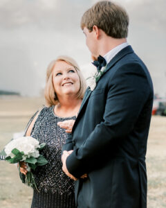 Groom sharing an emotional moment with his mother before the ceremony at a private Lake Mary wedding