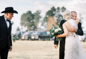 Bride embracing a family member before the ceremony during a private estate wedding at Lake Mary