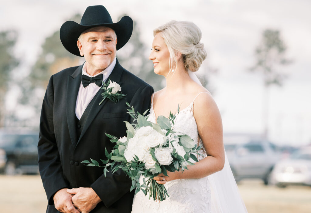 Bride smiling beside her father before the ceremony at a private Lake Mary wedding