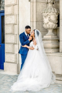 Luxury documentary Atlanta wedding photographer capturing an intimate close-up of groom gently tilting the bride’s face toward his beneath the iconic Swan House in Atlanta