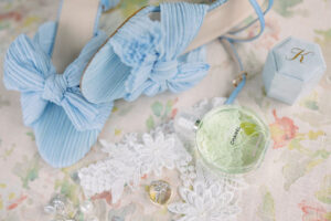 Editorial bridal details including blue heels perfume rings and lace styling for a private Lake Mary wedding