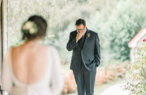 Emotional wedding photo of a groom reacting during a first look captured by a Luxury Atlanta Wedding Photographer