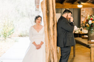 Luxury Atlanta Wedding Photographer capturing an emotional first touch and vow reading before the ceremony